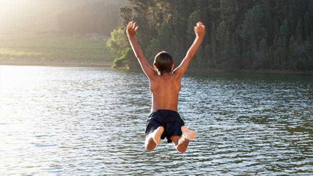 Boy Jumping Into Lake